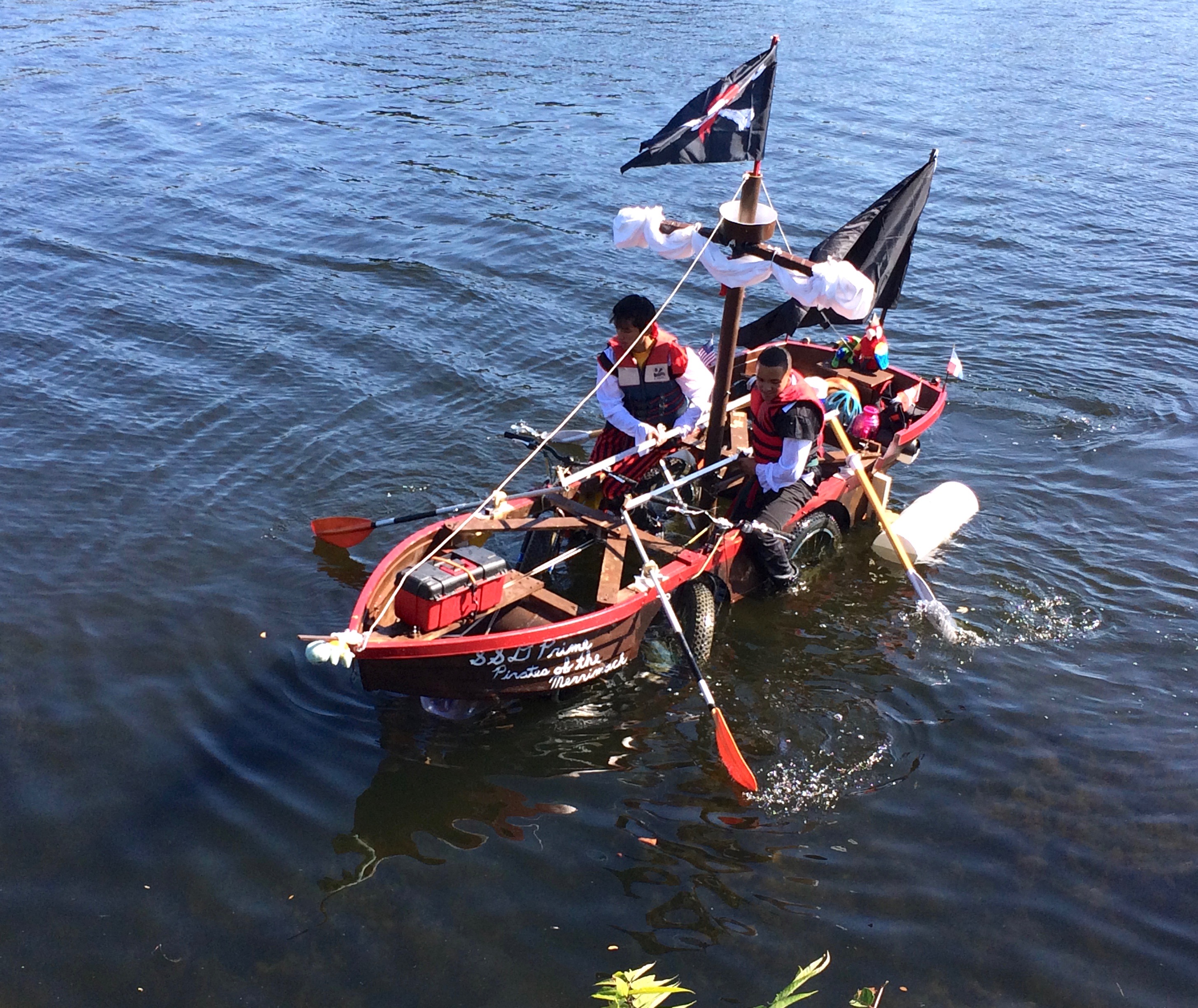 pirate ship sculpture rowing down the river